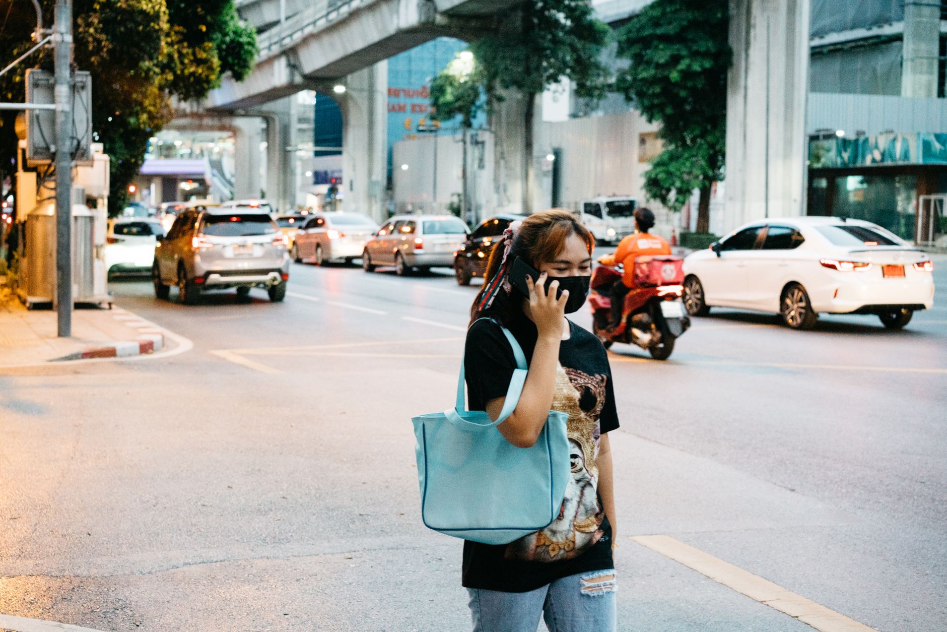 A woman on a phone call on a busy street