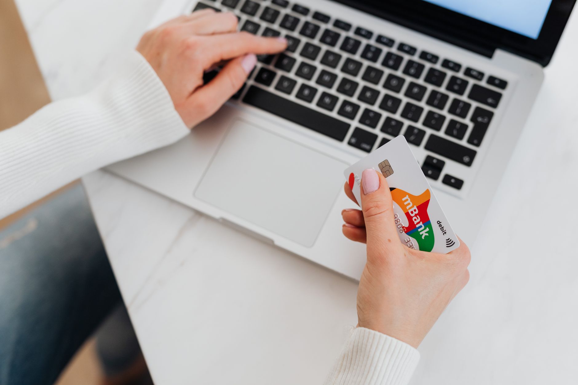 Paying for a subscription by card on a laptop