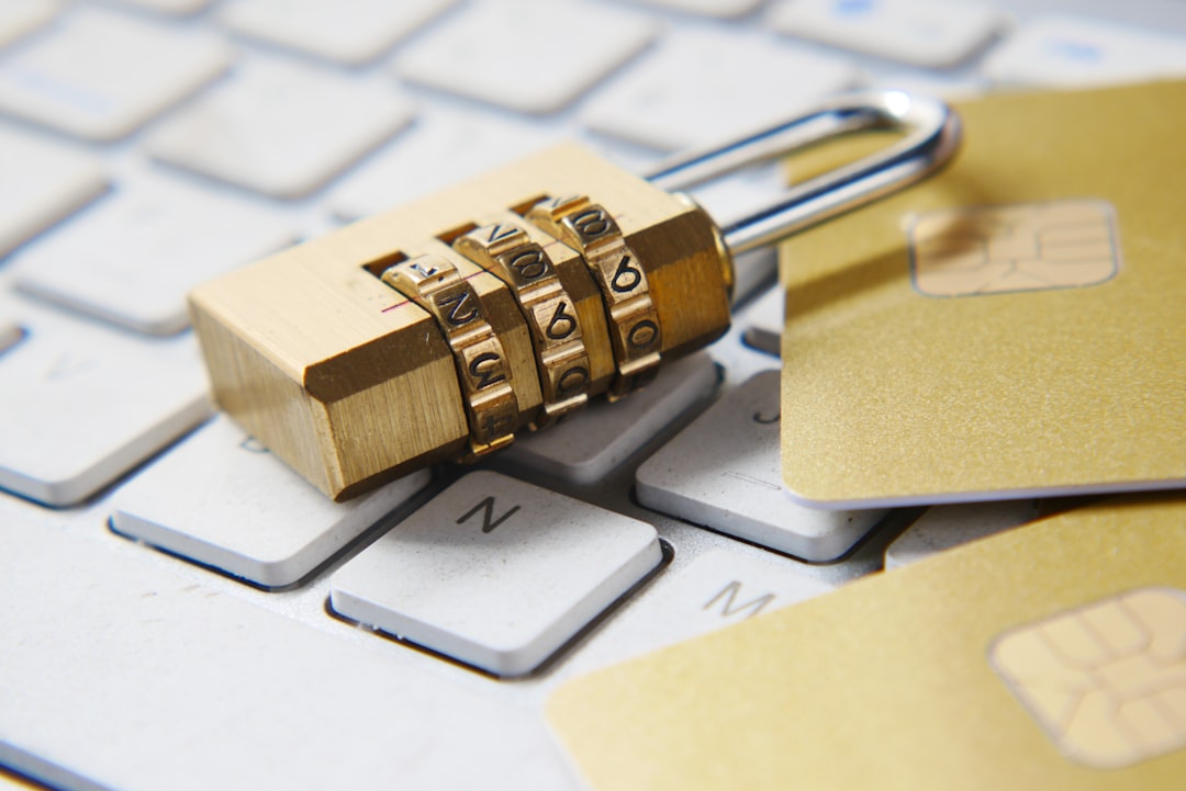 A padlock and payment cards on a keyboard